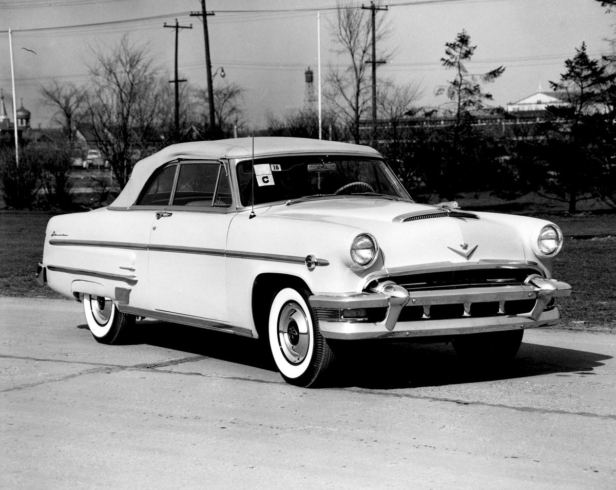 This archival image documents the 1954 Monarch Lucerne Coupe on scenic road with trees AR-2007-5 and is preserved in the Ford Heritage Vault as part of Ford Motor Company's historic photographic archive. Free for personal, non-commercial use. Ford...