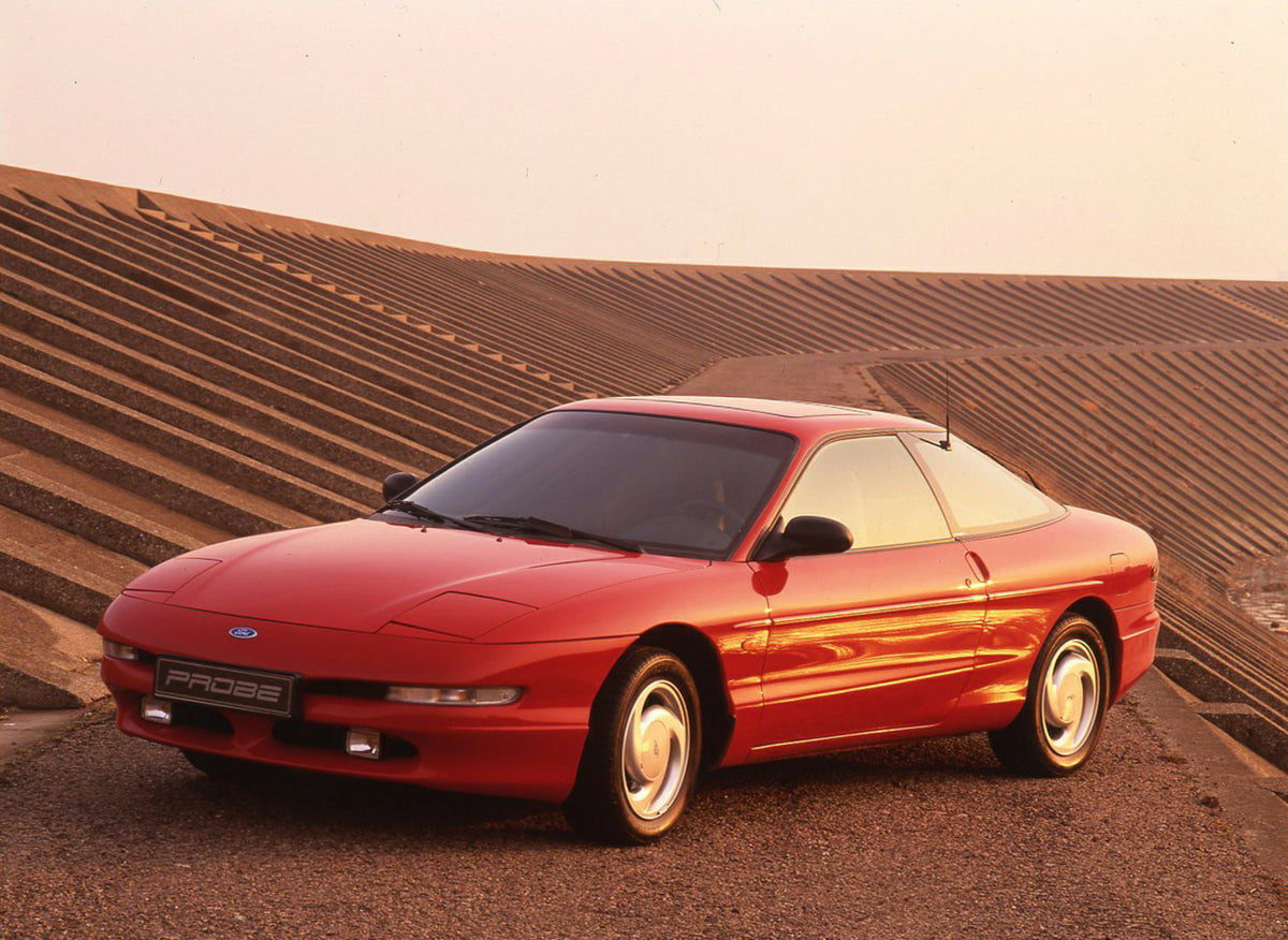 This archival image documents the 1993 Ford Probe on scenic road in Dunkirk and is preserved in the Ford Heritage Vault as part of Ford Motor Company's historic photographic archive. Free for personal, non-commercial use. Ford Heritage Vault refer...