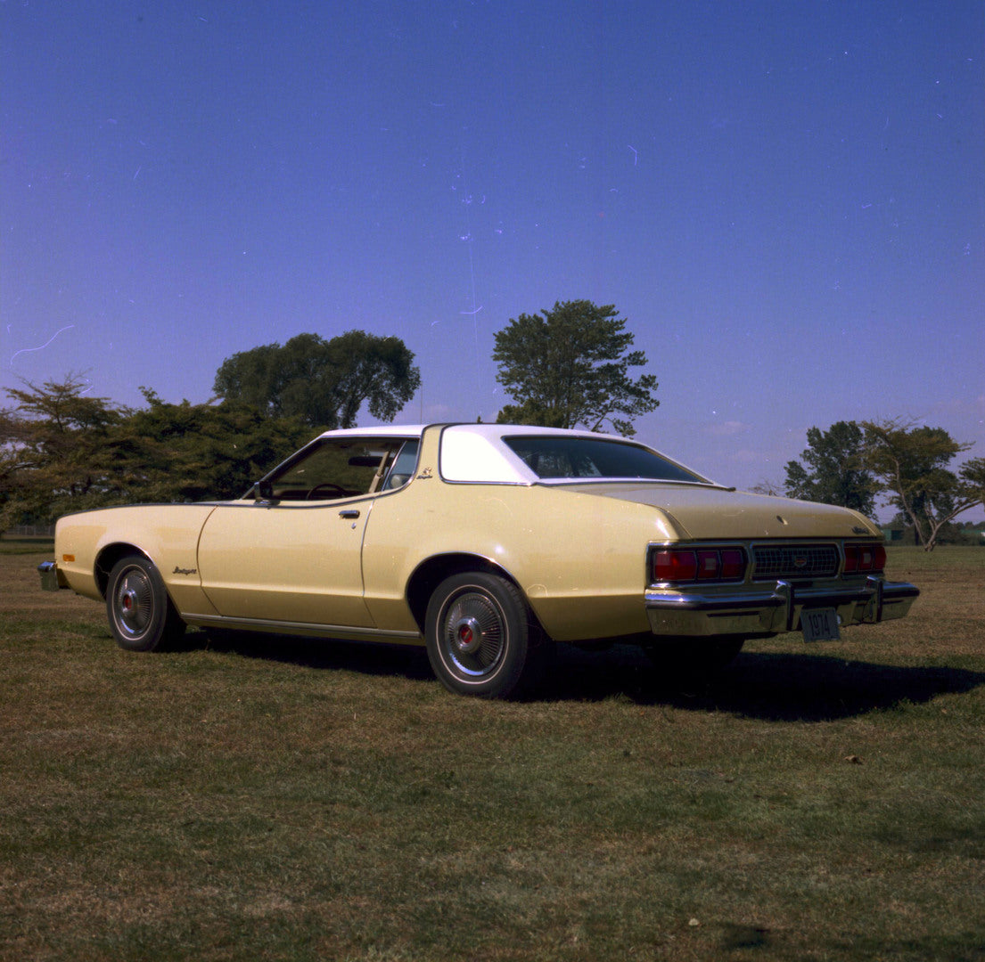 This archival image documents the 1974 Mercury Montego rear angle scenic and is preserved in the Ford Heritage Vault as part of Ford Motor Company's historic photographic archive. Free for personal, non-commercial use. Ford Heritage Vault referenc...