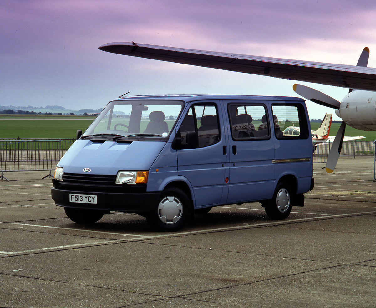 This archival image documents the 1988 Ford Transit Mark III on tarmac with plane and is preserved in the Ford Heritage Vault as part of Ford Motor Company's historic photographic archive. Free for personal, non-commercial use. Ford Heritage Vault...