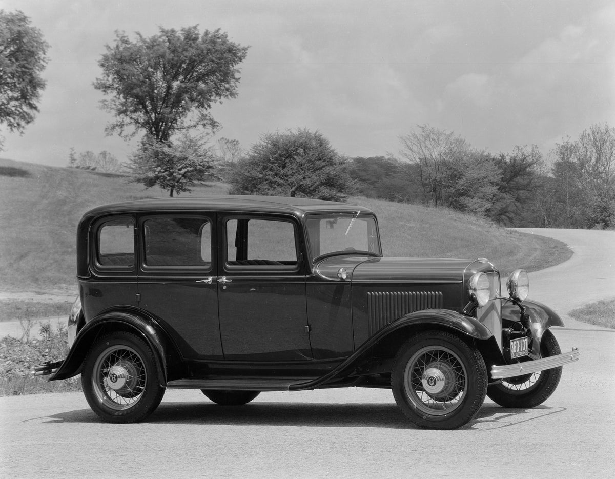 This archival image documents the 1932 Ford DeLuxe Fordor Sedan and is preserved in the Ford Heritage Vault as part of Ford Motor Company's historic photographic archive. Free for personal, non-commercial use. Ford Heritage Vault reference AR-2008...
