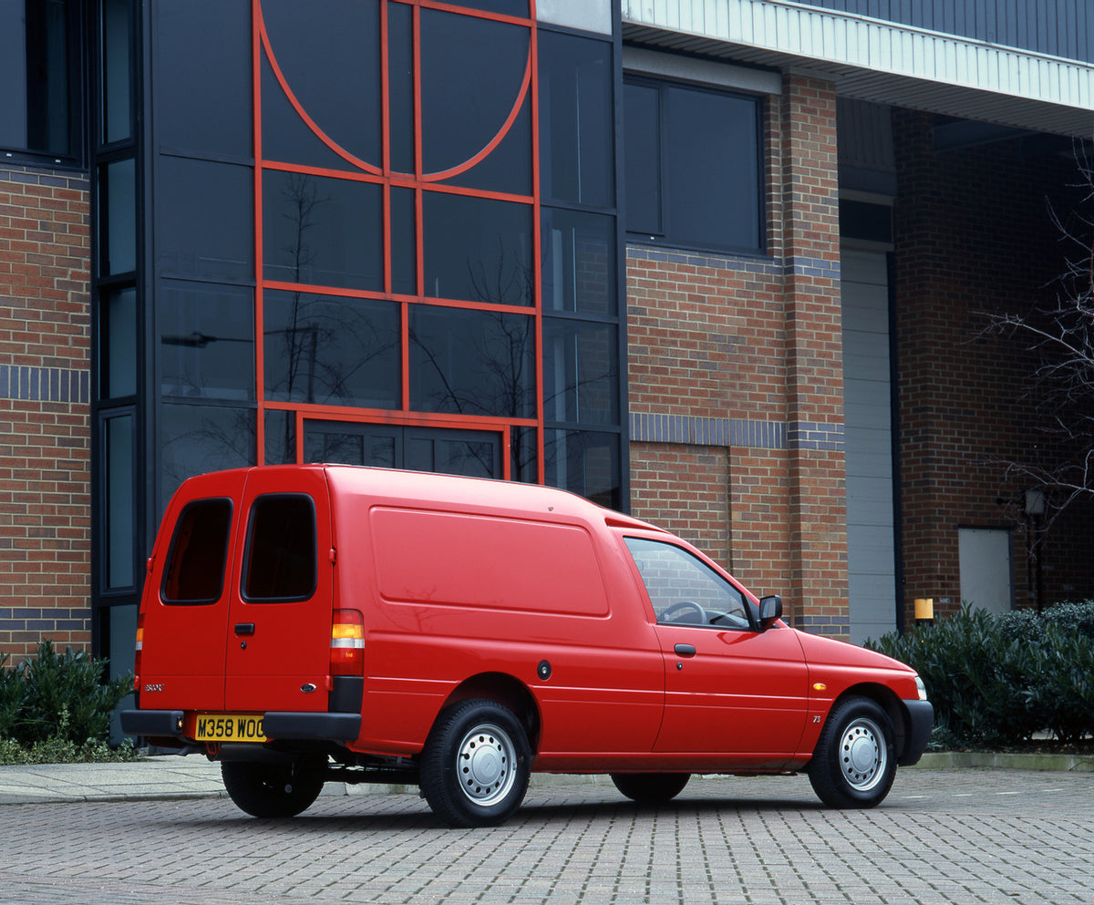 This archival image documents the 1995 Ford Escort Mark V Van rear view in front of building and is preserved in the Ford Heritage Vault as part of Ford Motor Company's historic photographic archive. Free for personal, non-commercial use. Ford Her...