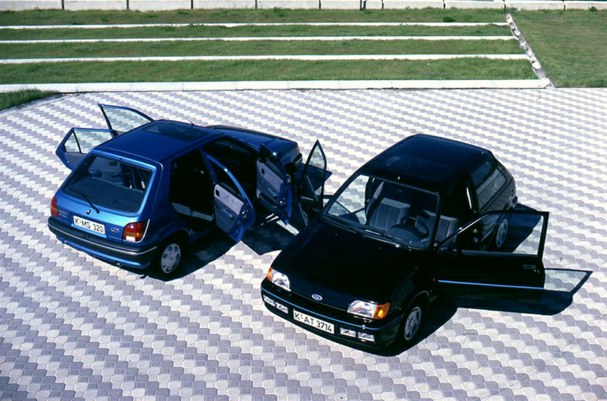 This archival image documents the 1988 Ford Fiesta Mark III LHD hatchbacks aerial view with open doors and is preserved in the Ford Heritage Vault as part of Ford Motor Company's historic photographic archive. Free for personal, non-commercial use...