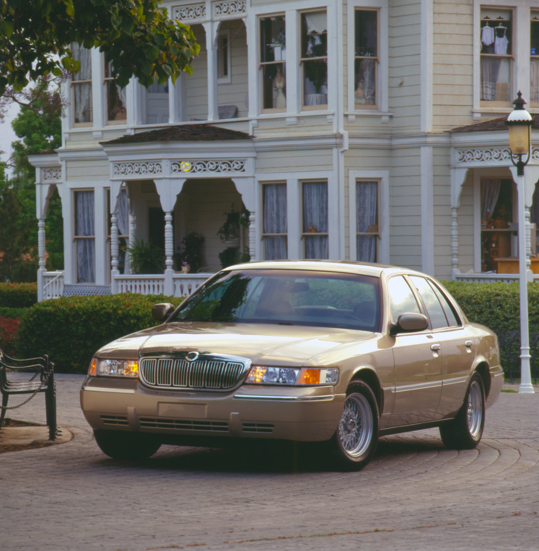 This archival image documents the 2000 Mercury Grand Marquis LS in front of house and is preserved in the Ford Heritage Vault as part of Ford Motor Company's historic photographic archive. Free for personal, non-commercial use. Ford Heritage Vault...