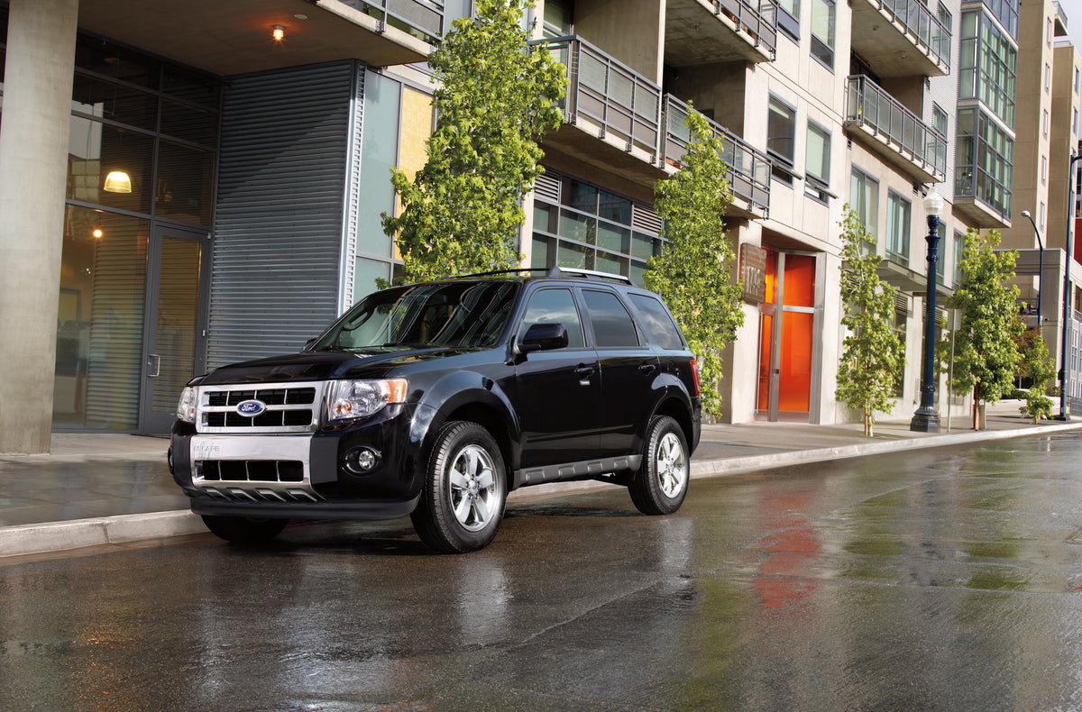 This archival image documents the 2012 Ford Escape in front of building and is preserved in the Ford Heritage Vault as part of Ford Motor Company's historic photographic archive. Free for personal, non-commercial use. Ford Heritage Vault reference...
