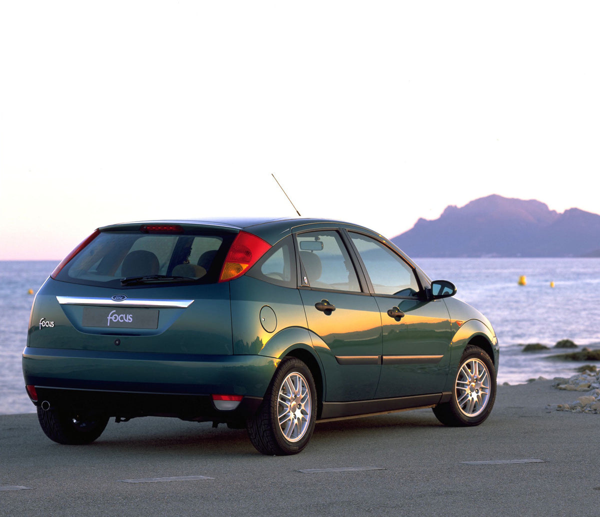 This archival image documents the 1998 Ford Focus rear view on scenic beach and is preserved in the Ford Heritage Vault as part of Ford Motor Company's historic photographic archive. Free for personal, non-commercial use. Ford Heritage Vault refer...