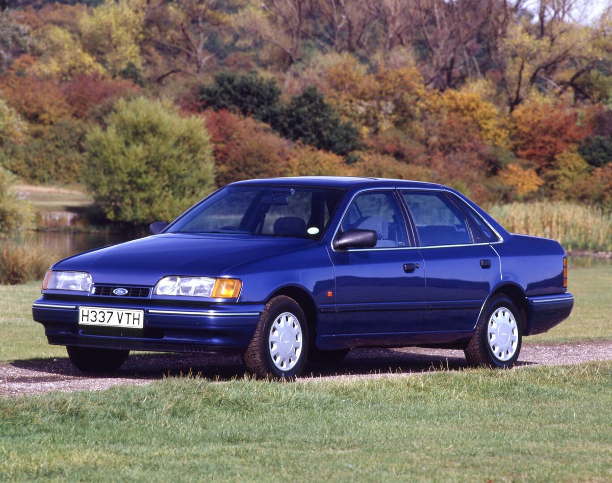 This archival image documents the 1990 Ford Granada Mark III GL closeup with scenic river and fall trees and is preserved in the Ford Heritage Vault as part of Ford Motor Company's historic photographic archive. Free for personal, non-commercial u...