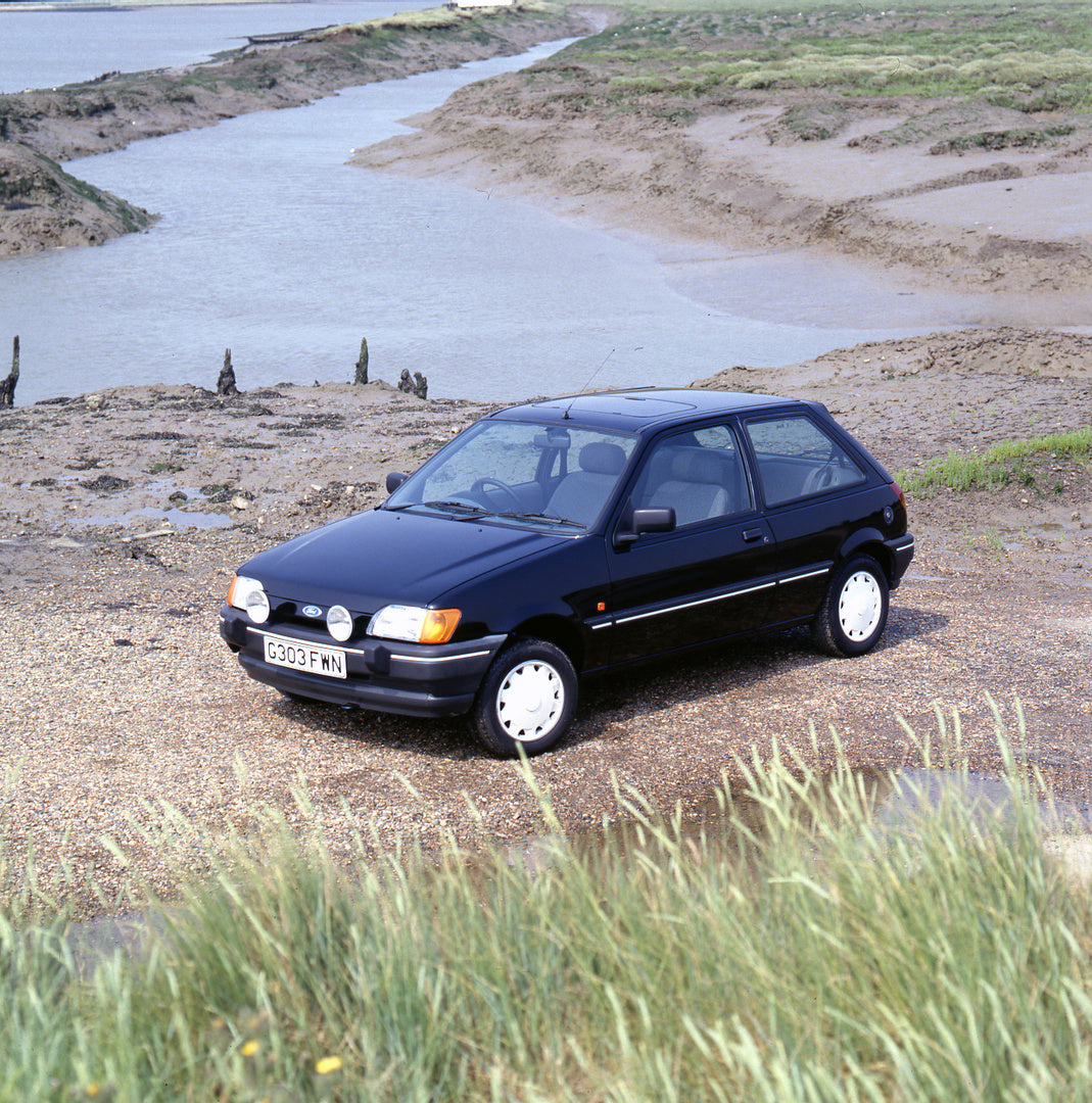 This archival image documents the 1989 Ford Fiesta Mark III 1.6 S on scenic beach during low tide and is preserved in the Ford Heritage Vault as part of Ford Motor Company's historic photographic archive. Free for personal, non-commercial use. For...