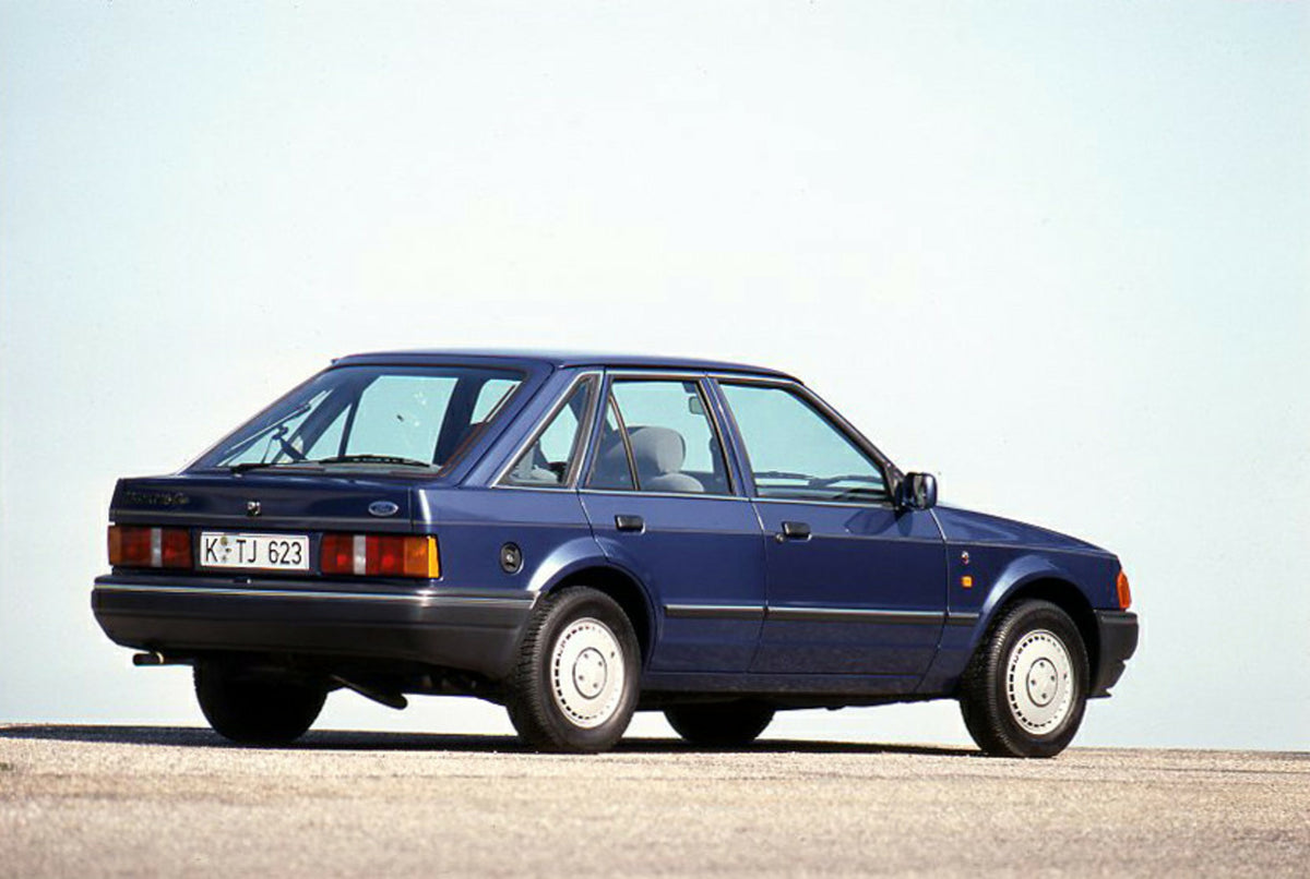 This archival image documents the 1989 Ford Escort Mark IV LHD rear view with scenic blue sky and is preserved in the Ford Heritage Vault as part of Ford Motor Company's historic photographic archive. Free for personal, non-commercial use. Ford He...