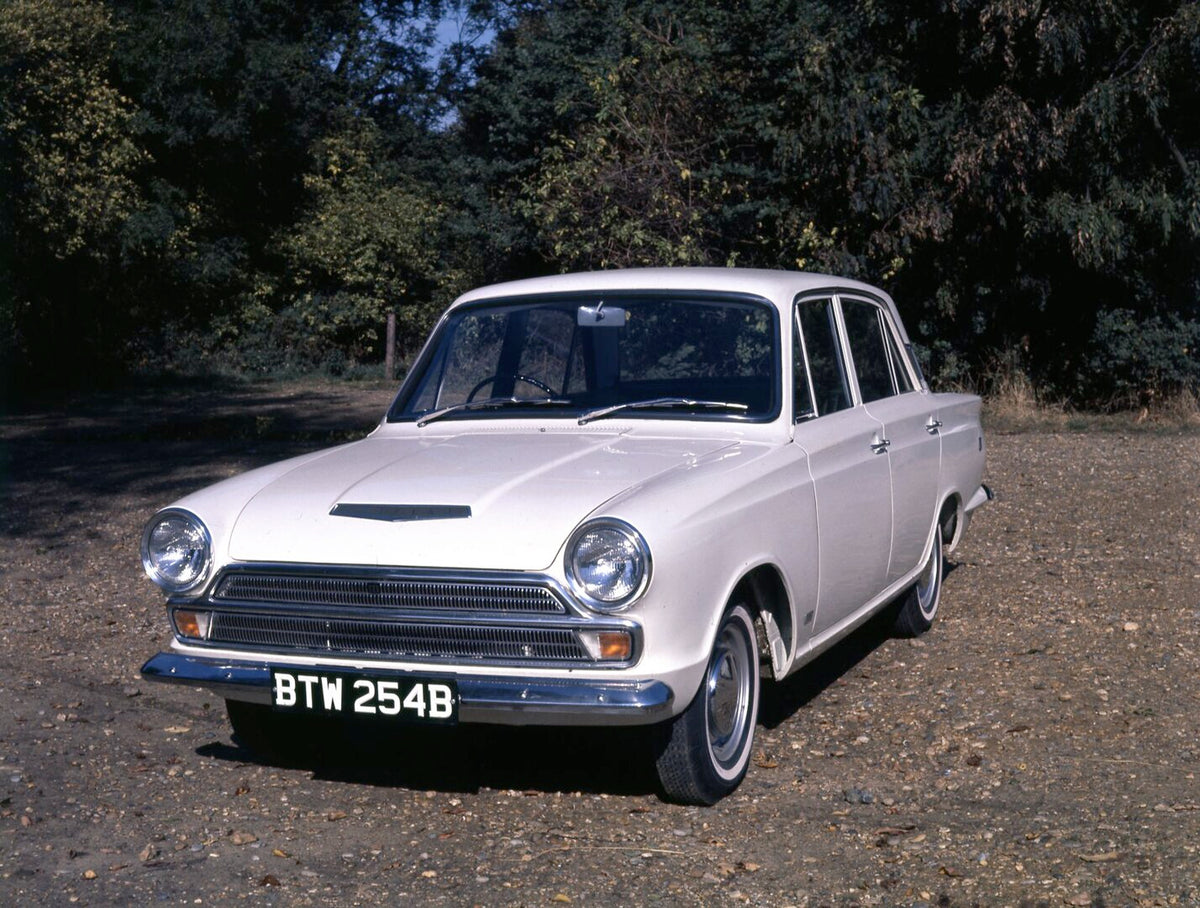 This archival image documents the 1965 Ford Cortina GT MK I with scenic trees and is preserved in the Ford Heritage Vault as part of Ford Motor Company's historic photographic archive. Free for personal, non-commercial use. Ford Heritage Vault ref...