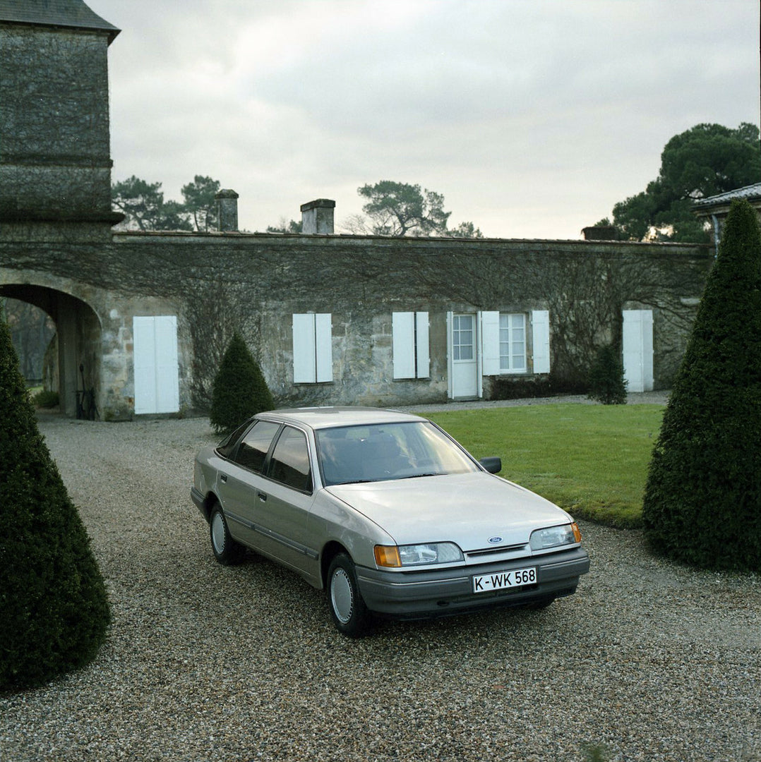 This archival image documents the 1984 Ford Scorpio Mark I LHD in scenic driveway with trees in Bordeaux and is preserved in the Ford Heritage Vault as part of Ford Motor Company's historic photographic archive. Free for personal, non-commercial u...