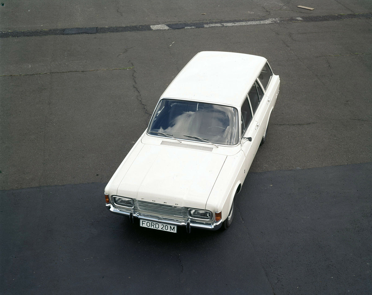 This archival image documents the 1970 Ford Taunus 20M aerial view on pavement and is preserved in the Ford Heritage Vault as part of Ford Motor Company's historic photographic archive. Free for personal, non-commercial use. Ford Heritage Vault re...