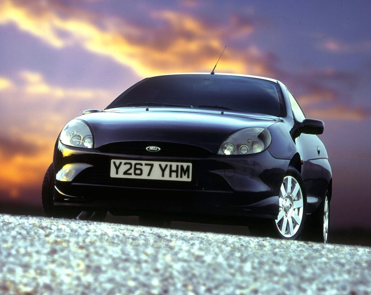 This archival image documents the 2001 Ford Puma with scenic sunset sky and is preserved in the Ford Heritage Vault as part of Ford Motor Company's historic photographic archive. Free for personal, non-commercial use. Ford Heritage Vault reference...