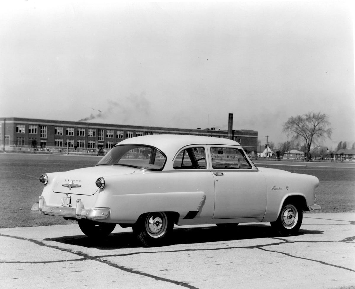 This archival image documents the 1952 Meteor Mainline Coupe rear view on road with building AR-2007-5 and is preserved in the Ford Heritage Vault as part of Ford Motor Company's historic photographic archive. Free for personal, non-commercial use...