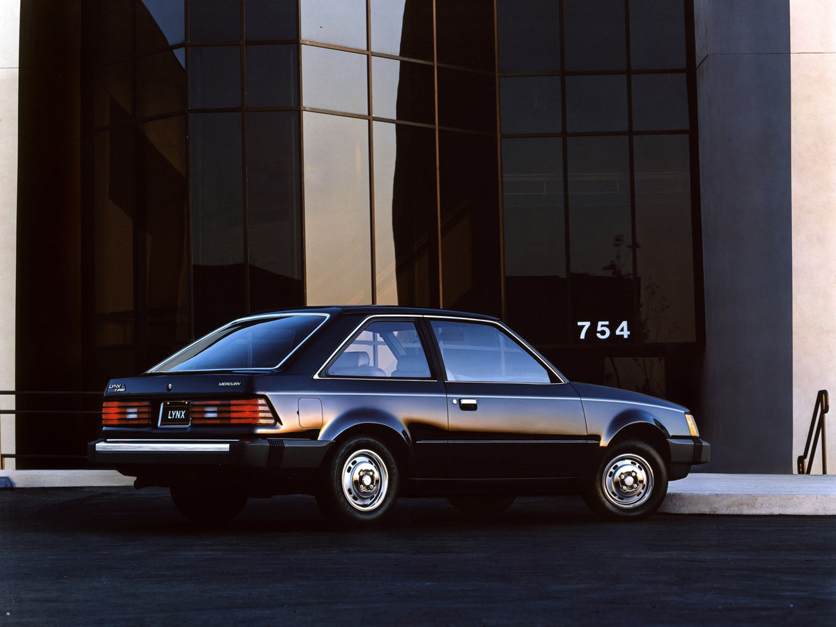 This archival image documents the 1985 Mercury Lynx L in Front of a Building and is preserved in the Ford Heritage Vault as part of Ford Motor Company's historic photographic archive. Free for personal, non-commercial use. Ford Heritage Vault refe...