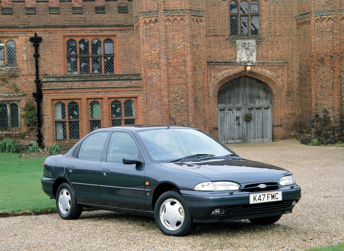 This archival image documents the 1992 Ford Mondeo MK I in front of brick building 1992-741 and is preserved in the Ford Heritage Vault as part of Ford Motor Company's historic photographic archive. Free for personal, non-commercial use. Ford Heri...