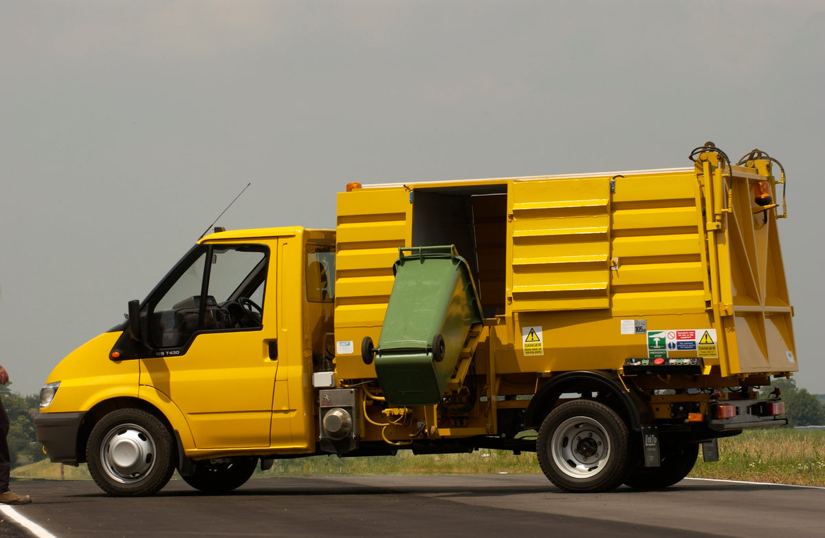 This archival image documents the 2003 Ford Transit Mark IV conversion garbage truck side view on scenic road and is preserved in the Ford Heritage Vault as part of Ford Motor Company's historic photographic archive. Free for personal, non-commerc...