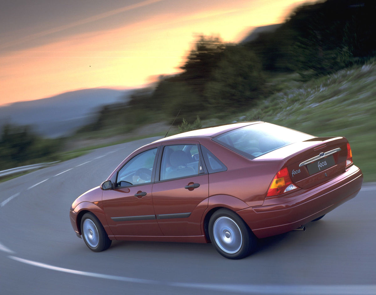 This archival image documents the 1998 Ford Focus rear view action shot on scenic road and is preserved in the Ford Heritage Vault as part of Ford Motor Company's historic photographic archive. Free for personal, non-commercial use. Ford Heritage ...