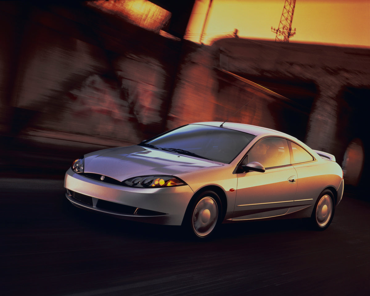 This archival image documents the 1999 Mercury Cougar with Blurred Background and is preserved in the Ford Heritage Vault as part of Ford Motor Company's historic photographic archive. Free for personal, non-commercial use. Ford Heritage Vault ref...