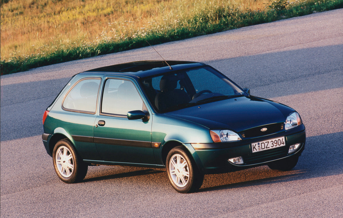 This archival image documents the 1999 Ford Fiesta Mark IV on scenic road and is preserved in the Ford Heritage Vault as part of Ford Motor Company's historic photographic archive. Free for personal, non-commercial use. Ford Heritage Vault referen...