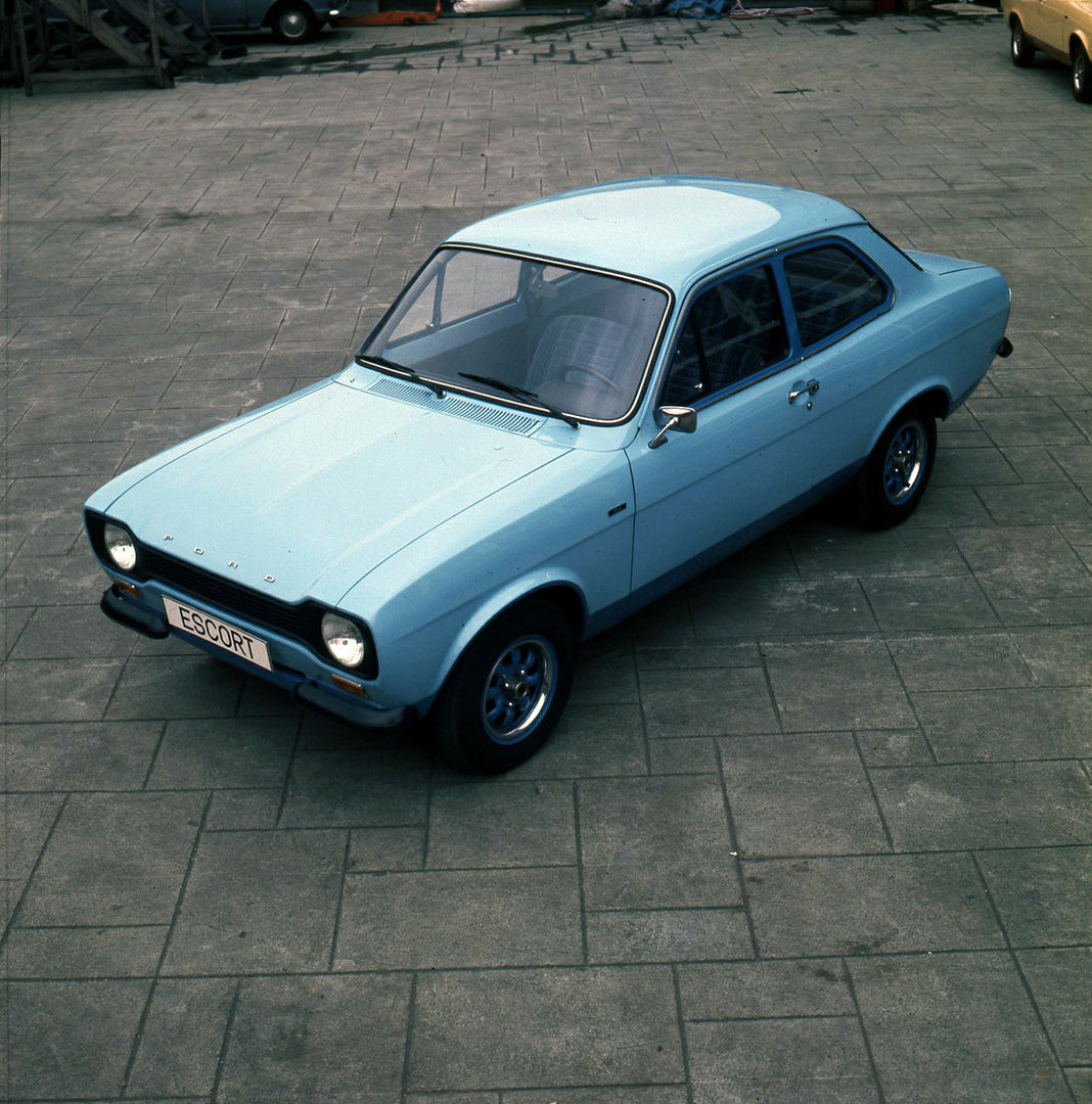 This archival image documents the 1974 Ford Escort Mark I LHD aerial view on pavement and is preserved in the Ford Heritage Vault as part of Ford Motor Company's historic photographic archive. Free for personal, non-commercial use. Ford Heritage V...