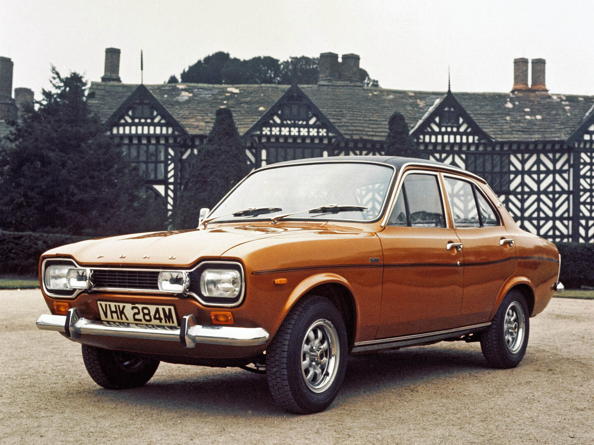 This archival image documents the 1974 Ford Escort 1300E front 3/4 view in front of building 1974-365 and is preserved in the Ford Heritage Vault as part of Ford Motor Company's historic photographic archive. Free for personal, non-commercial use....