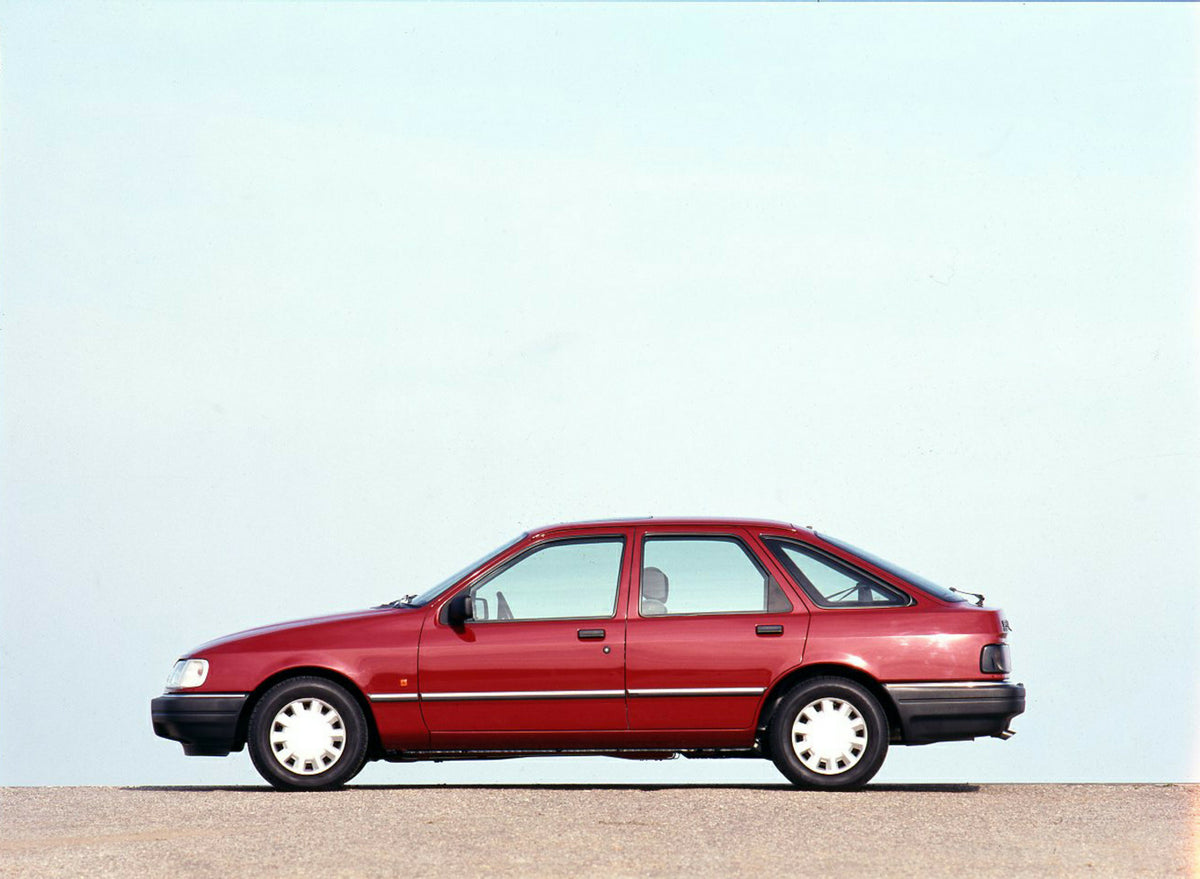 This archival image documents the 1989 Ford Sierra side view with scenic blue sky and is preserved in the Ford Heritage Vault as part of Ford Motor Company's historic photographic archive. Free for personal, non-commercial use. Ford Heritage Vault...