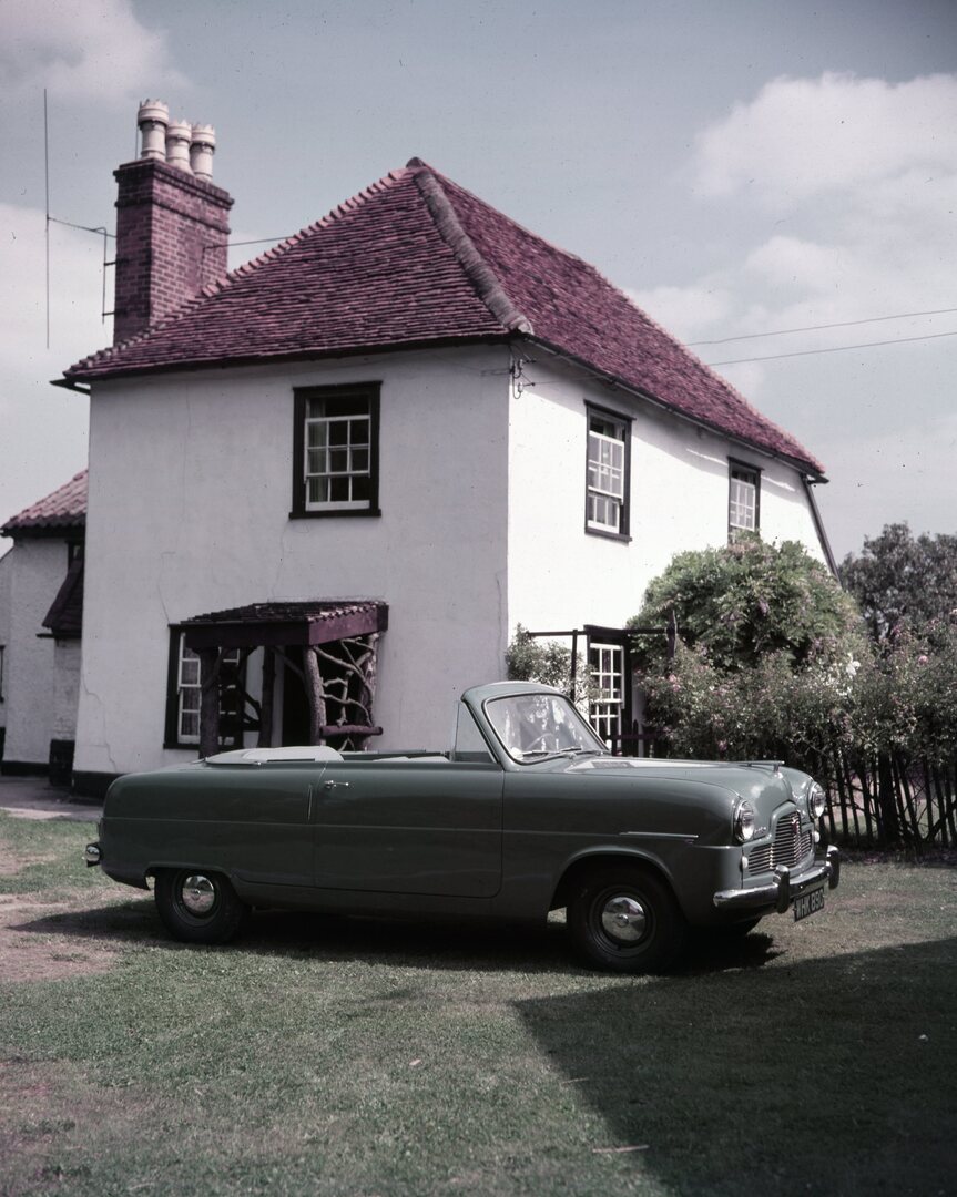 This archival image documents the 1954 Ford Zephyr Mark I convertible side view in front of scenic house and is preserved in the Ford Heritage Vault as part of Ford Motor Company's historic photographic archive. Free for personal, non-commercial u...