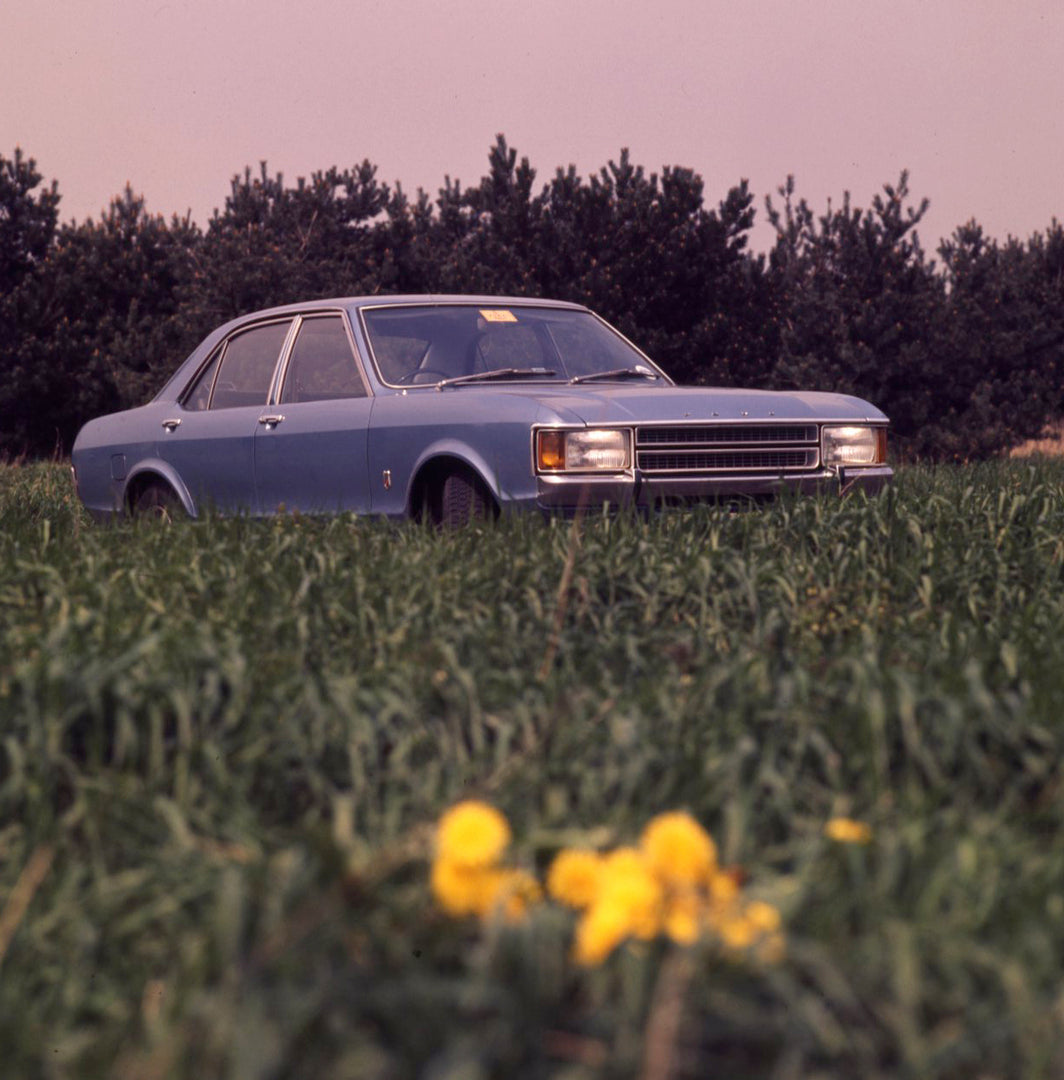 This archival image documents the 1977 Ford Granada Mark I in scenic field with trees and is preserved in the Ford Heritage Vault as part of Ford Motor Company's historic photographic archive. Free for personal, non-commercial use. Ford Heritage V...