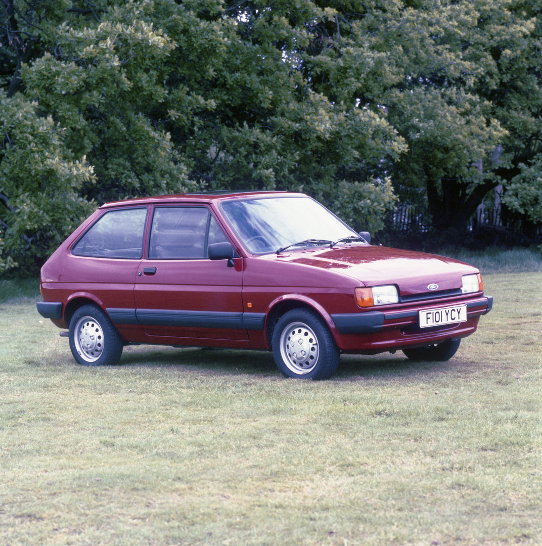 This archival image documents the 1988 Ford Fiesta Mark II L 1.4 in scenic field with trees and is preserved in the Ford Heritage Vault as part of Ford Motor Company's historic photographic archive. Free for personal, non-commercial use. Ford Heri...