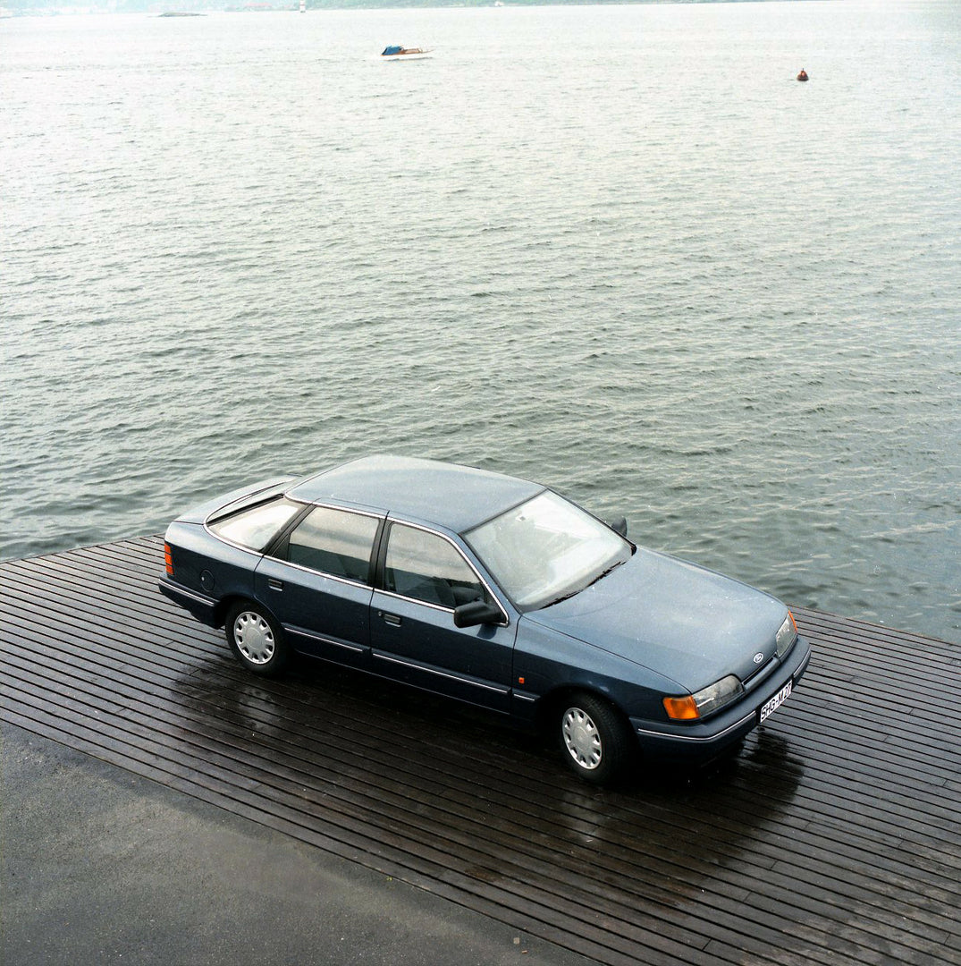 This archival image documents the 1984 Ford Scorpio Mark I GL LHD aerial view on scenic dock in Norway and is preserved in the Ford Heritage Vault as part of Ford Motor Company's historic photographic archive. Free for personal, non-commercial use...