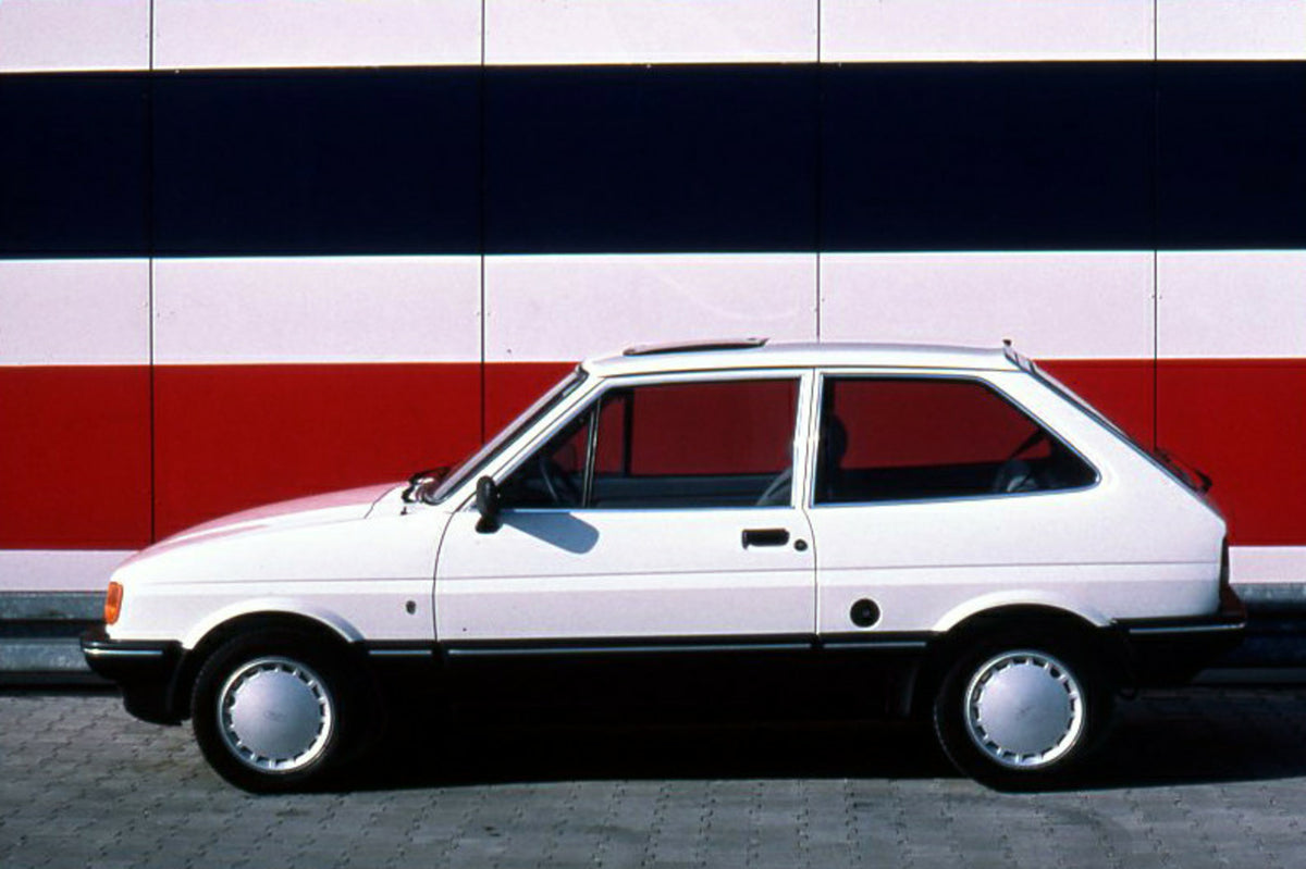 This archival image documents the 1986 Ford Fiesta Mark II 1.4 Ghia LHD side view in front of scenic wall and is preserved in the Ford Heritage Vault as part of Ford Motor Company's historic photographic archive. Free for personal, non-commercial ...