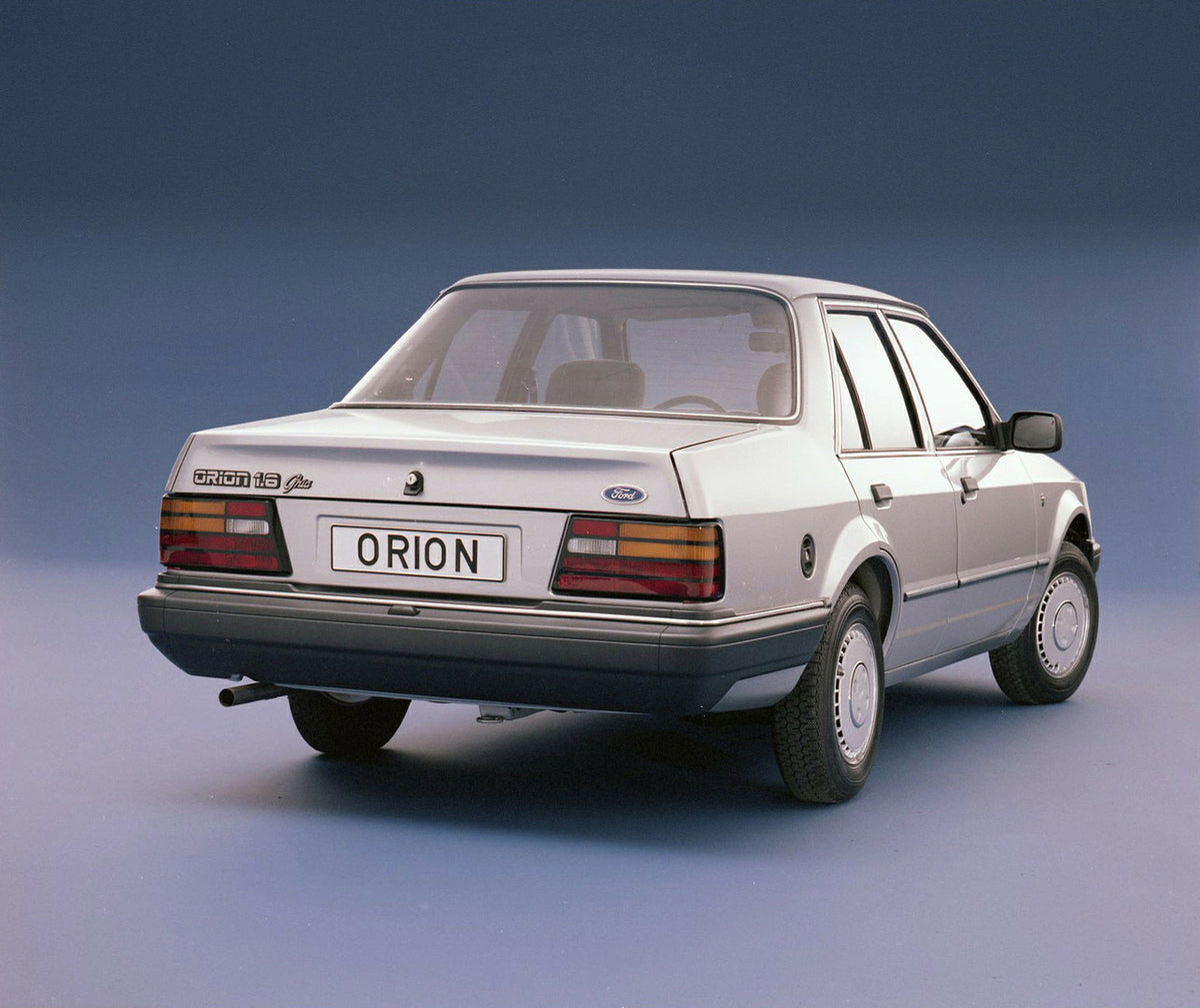 This archival image documents the 1986 Ford Orion Mark II 1.6 Ghia LHD rear view in studio and is preserved in the Ford Heritage Vault as part of Ford Motor Company's historic photographic archive. Free for personal, non-commercial use. Ford Herit...