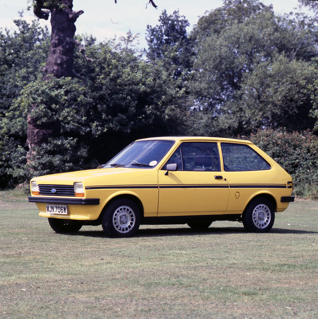 This archival image documents the 1980 Ford Fiesta Mark I S in scenic field with trees and is preserved in the Ford Heritage Vault as part of Ford Motor Company's historic photographic archive. Free for personal, non-commercial use. Ford Heritage ...