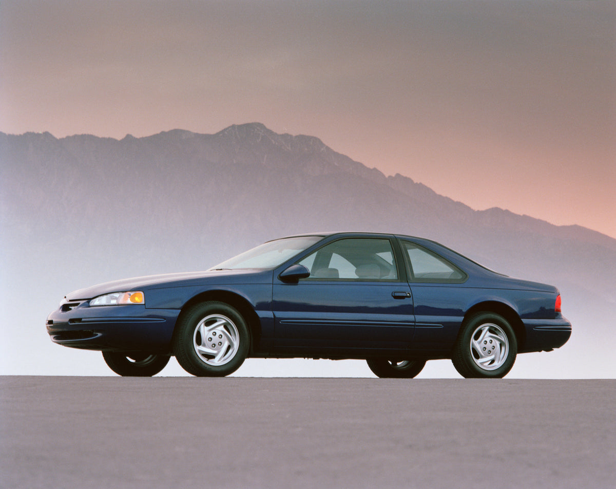 This archival image documents the 1996 Ford Thunderbird LX scenic in mountains and is preserved in the Ford Heritage Vault as part of Ford Motor Company's historic photographic archive. Free for personal, non-commercial use. Ford Heritage Vault re...