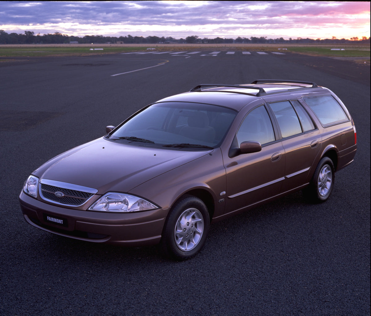 This archival image documents the 1998 Ford Falcon Fairmont on road with scenic sunset sky and is preserved in the Ford Heritage Vault as part of Ford Motor Company's historic photographic archive. Free for personal, non-commercial use. Ford Herit...