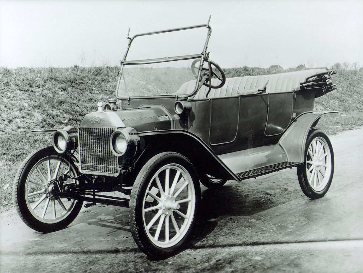 This archival image documents the c 1908 Model T on scenic road and is preserved in the Ford Heritage Vault as part of Ford Motor Company's historic photographic archive. Free for personal, non-commercial use. Ford Heritage Vault reference AR-2008...