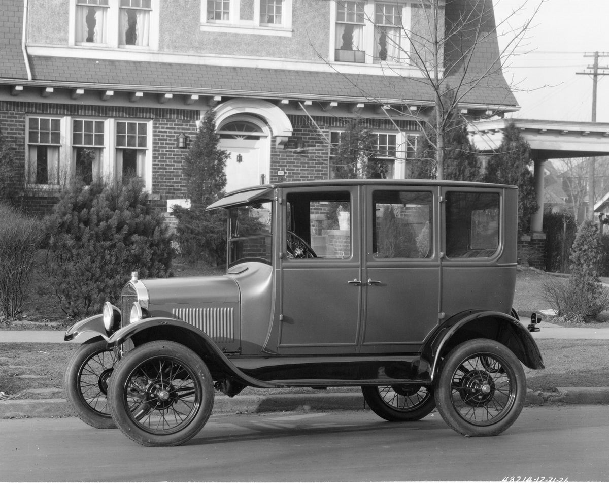 This archival image documents the 1927 Ford Model T Fordor Sedan and is preserved in the Ford Heritage Vault as part of Ford Motor Company's historic photographic archive. Free for personal, non-commercial use. Ford Heritage Vault reference AR-200...