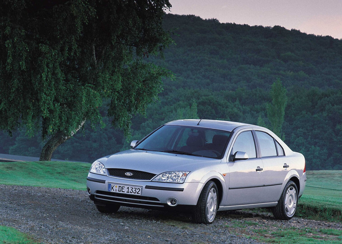 This archival image documents the 2001 Ford Mondeo Mark I with scenic trees and is preserved in the Ford Heritage Vault as part of Ford Motor Company's historic photographic archive. Free for personal, non-commercial use. Ford Heritage Vault refer...