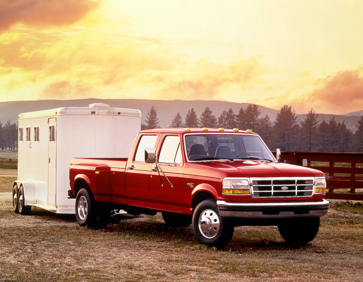 This archival image documents the 1996 Ford F350 XLT CrewCab towing trailer and is preserved in the Ford Heritage Vault as part of Ford Motor Company's historic photographic archive. Free for personal, non-commercial use. Ford Heritage Vault refer...