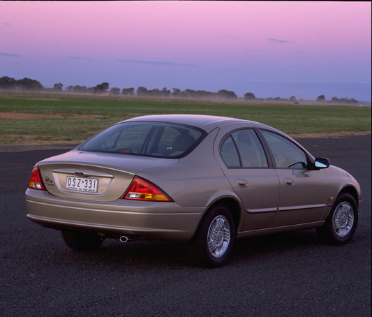 1998 Ford Falcon Futura rear view on road with scenic sunset sky HV 1998-0073