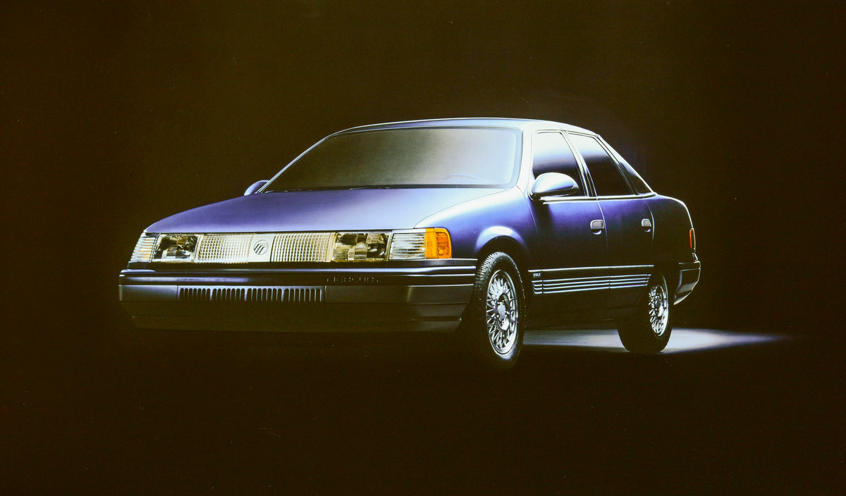 This archival image documents the 1986 Mercury Sable four-door and is preserved in the Ford Heritage Vault as part of Ford Motor Company's historic photographic archive. Free for personal, non-commercial use. Ford Heritage Vault reference AR-2001-...