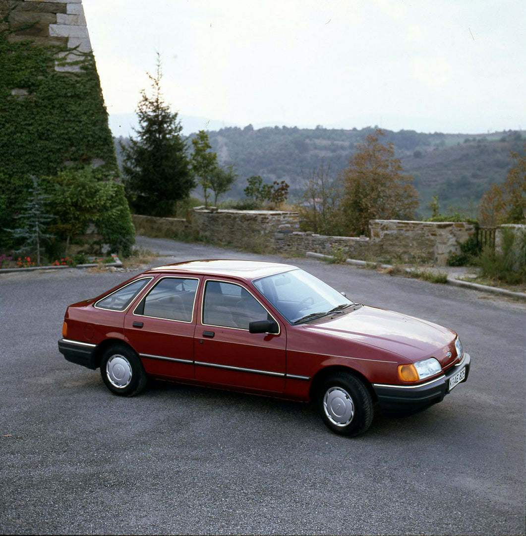 This archival image documents the 1986 Heritage Archive - 1987 1/2 Ford Sierra on scenic road with trees in Spain and is preserved in the Ford Heritage Vault as part of Ford Motor Company's historic photographic archive. Free for personal, non-com...