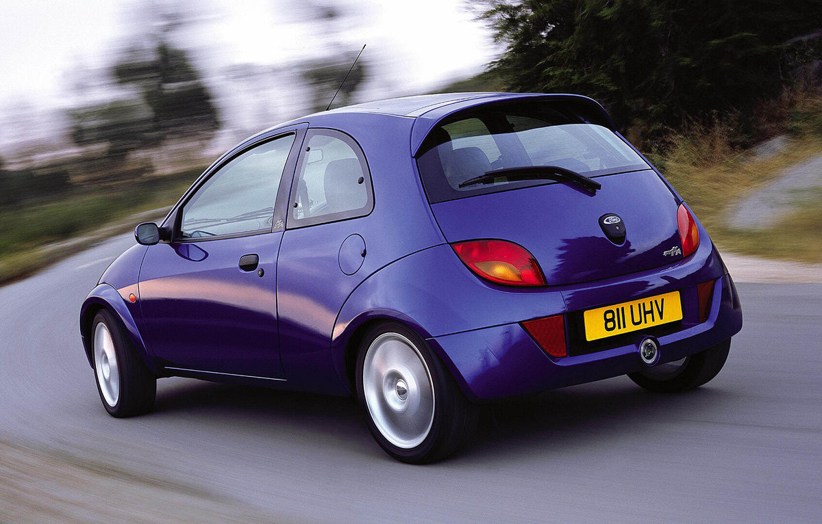 This archival image documents the 2002 Ford Ka Mark I rear view action shot on scenic road and is preserved in the Ford Heritage Vault as part of Ford Motor Company's historic photographic archive. Free for personal, non-commercial use. Ford Herit...