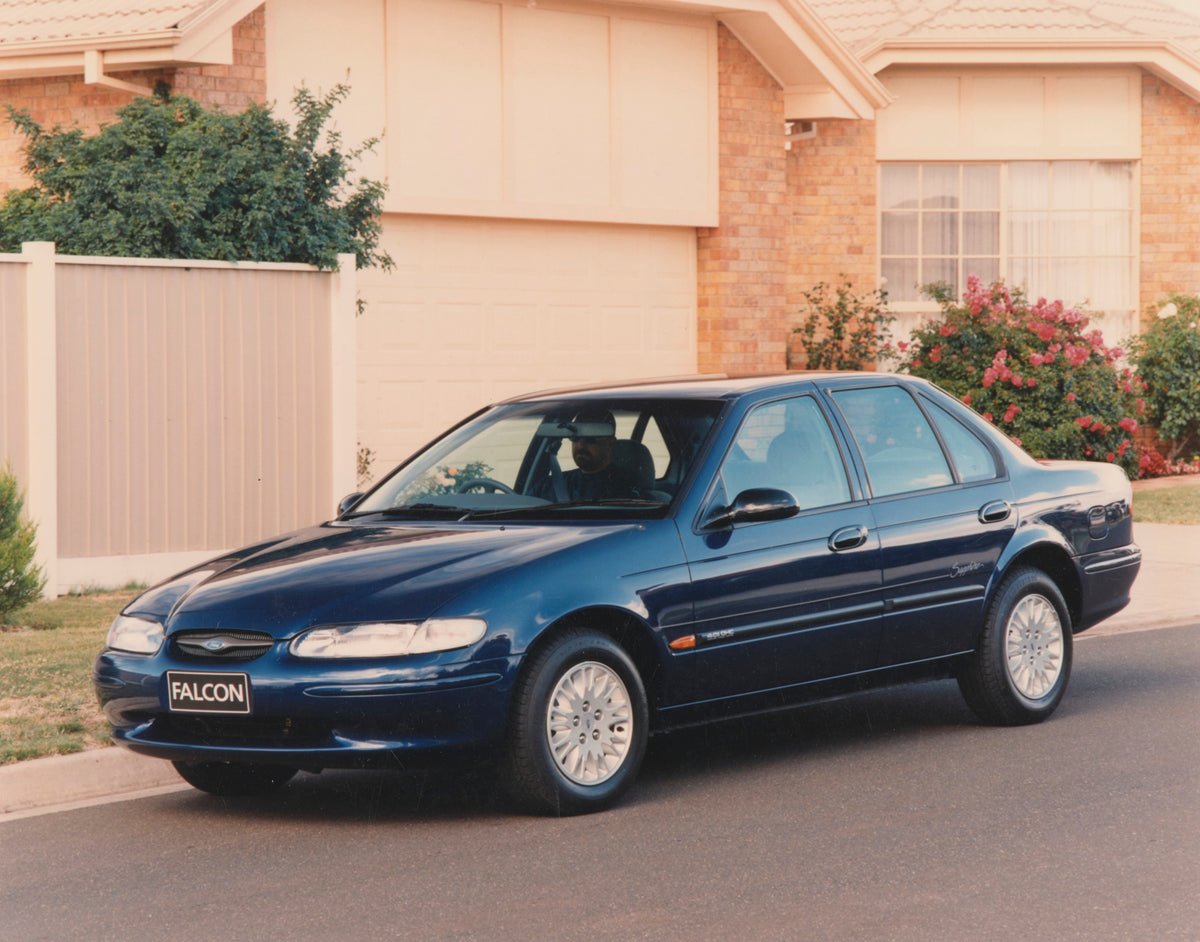 This archival image documents the 1998 Ford EL Falcon Sapphire Sedan Passenger Side Front End View on Neighborhood Street FAP-2011-3 and is preserved in the Ford Heritage Vault as part of Ford Motor Company's historic photographic archive. Free fo...