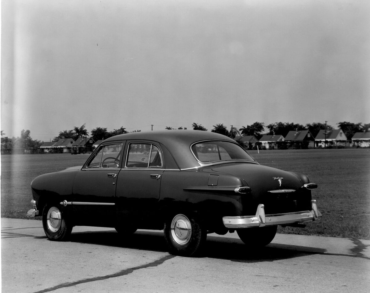 This archival image documents the 1951 Meteor Sedan rear view on road with houses in distance AR-2007-5 and is preserved in the Ford Heritage Vault as part of Ford Motor Company's historic photographic archive. Free for personal, non-commercial us...
