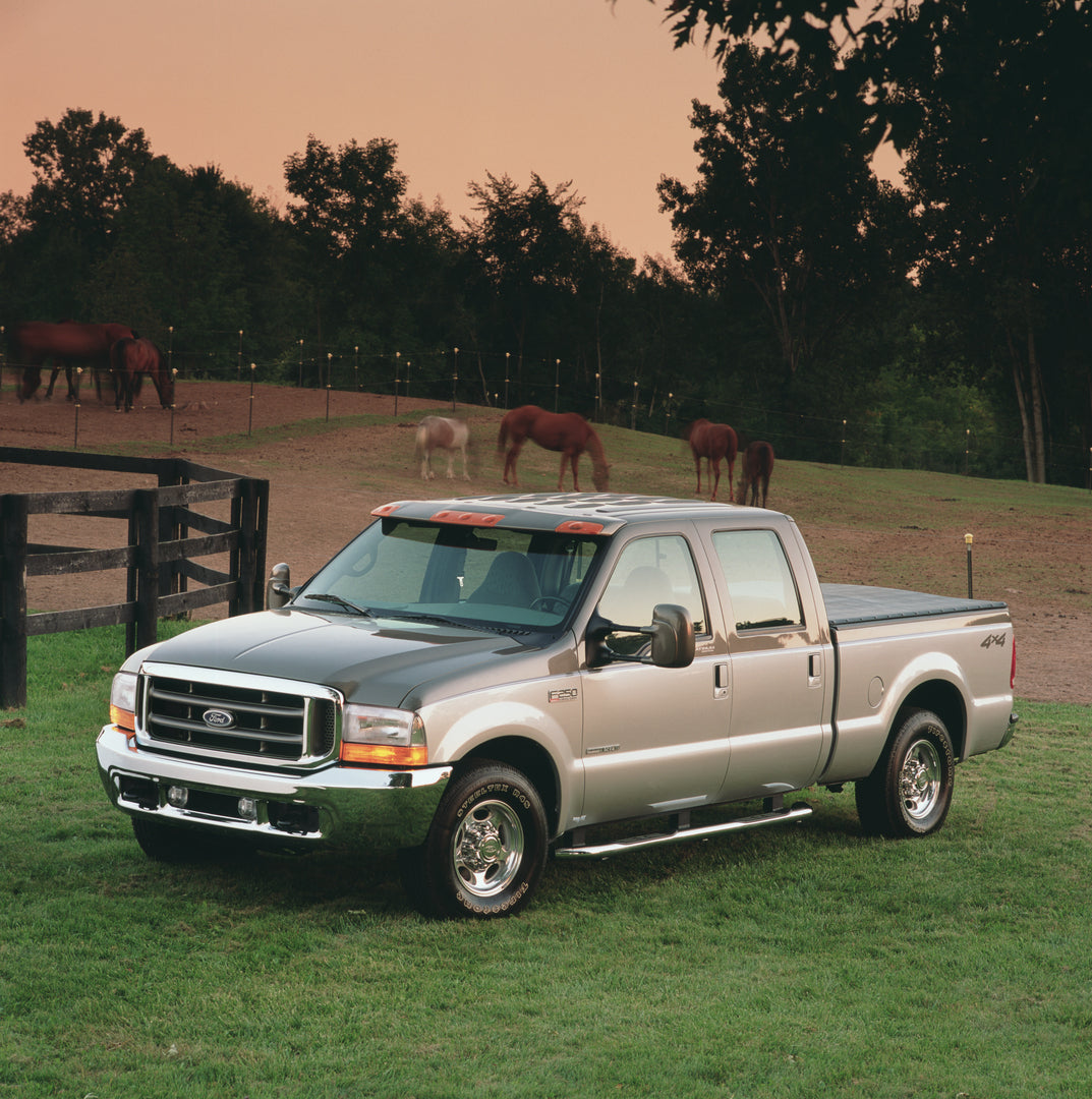 This archival image documents the 2001 Ford F-350 Super Duty Platinum Edition with horses and is preserved in the Ford Heritage Vault as part of Ford Motor Company's historic photographic archive. Free for personal, non-commercial use. Ford Herita...