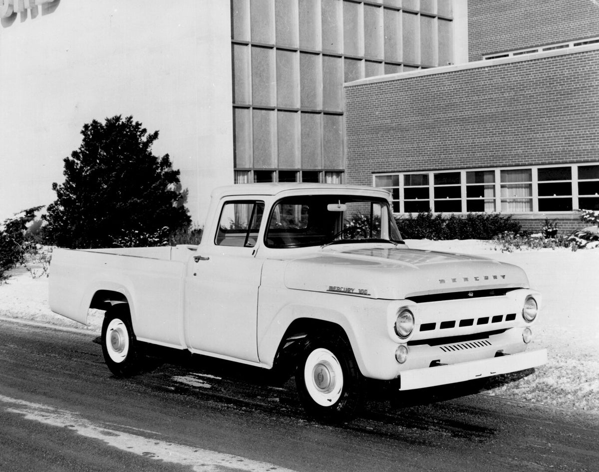 This archival image documents the 1956 Mercury M-100 on snowy road in front of building AR-2007-5 and is preserved in the Ford Heritage Vault as part of Ford Motor Company's historic photographic archive. Free for personal, non-commercial use. For...