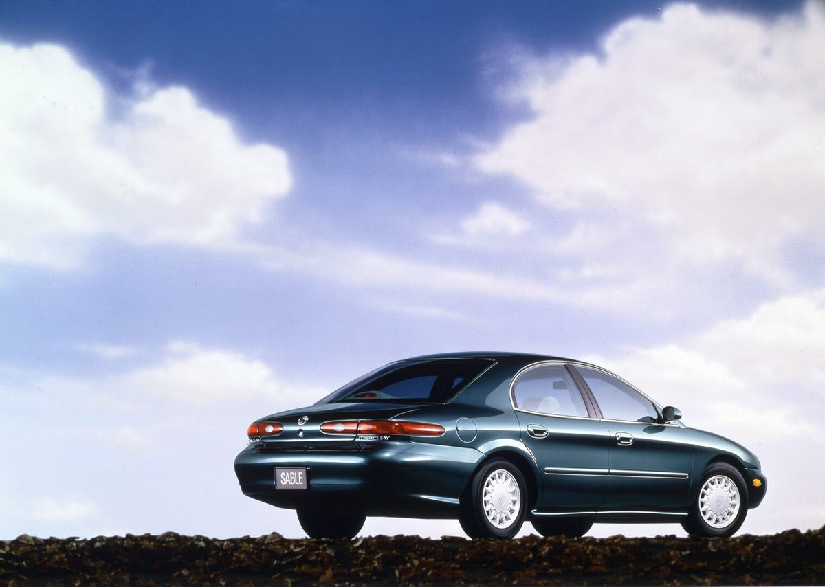 This archival image documents the 1997 Mercury Sable rear angle with clouds in background CN325015-003 and is preserved in the Ford Heritage Vault as part of Ford Motor Company's historic photographic archive. Free for personal, non-commercial use...
