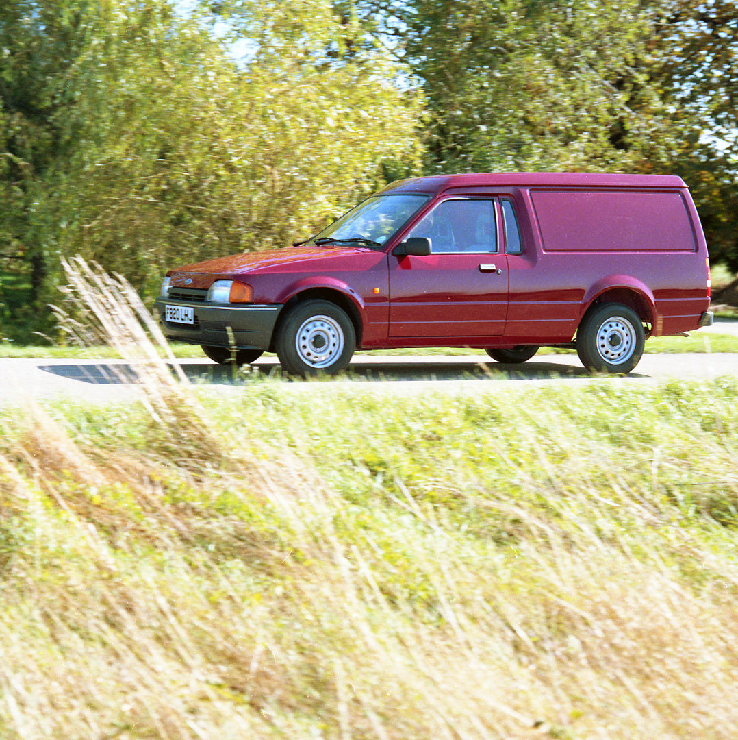 This archival image documents the 1988 Ford Escort Mark IV 6/8 Counterweight Van for Motor Show action shot on scenic road and is preserved in the Ford Heritage Vault as part of Ford Motor Company's historic photographic archive. Free for personal...